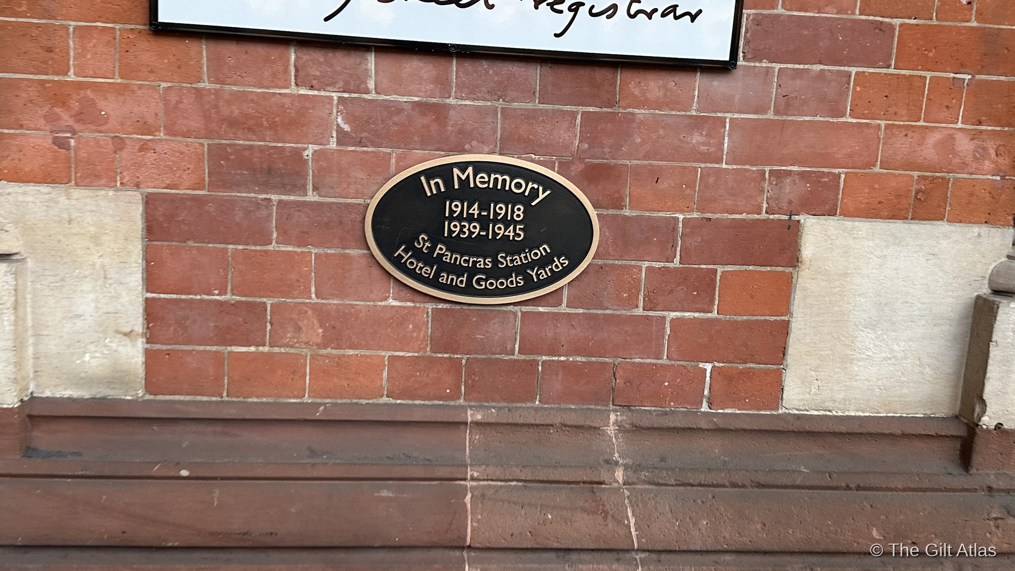 Memorial plaque on the St. Pancras Station Hotel and Goods Yards wall — In Memory 1914–1918 and 1939–1945.