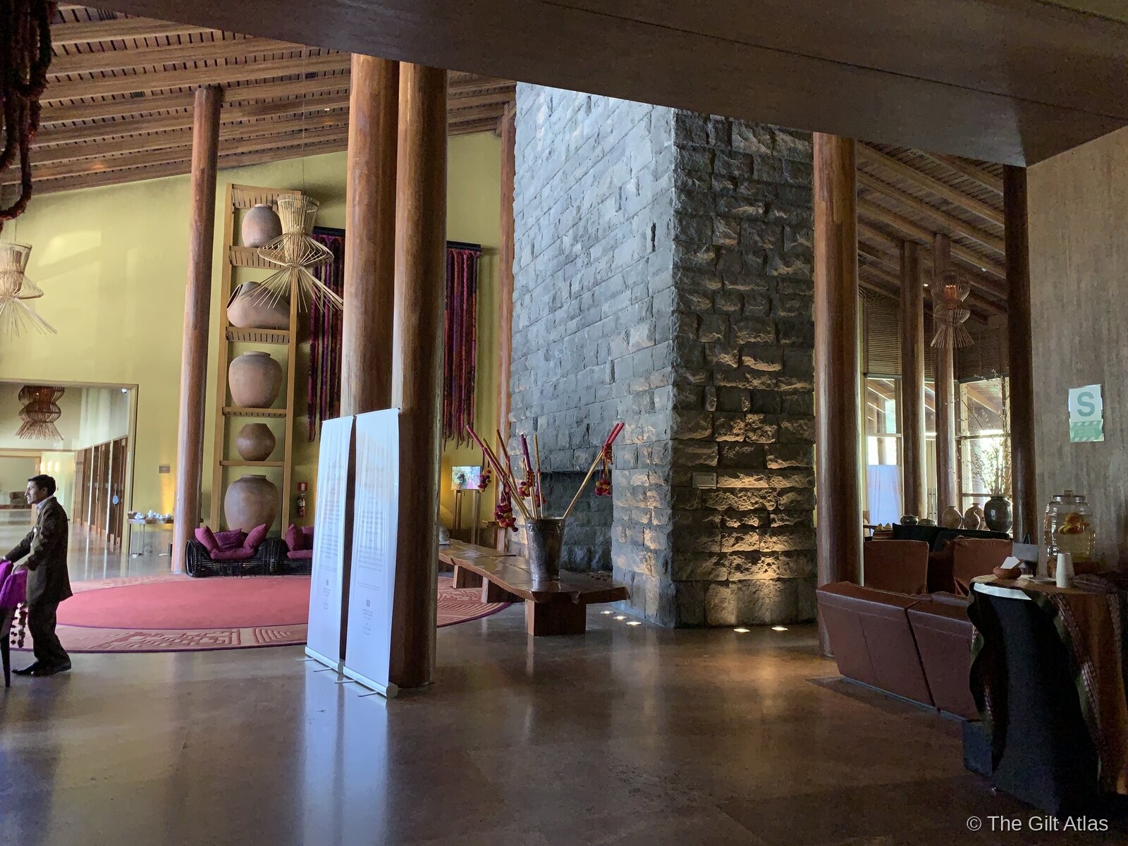 Tambo del Inka lobby with stone columns and tall ceilings