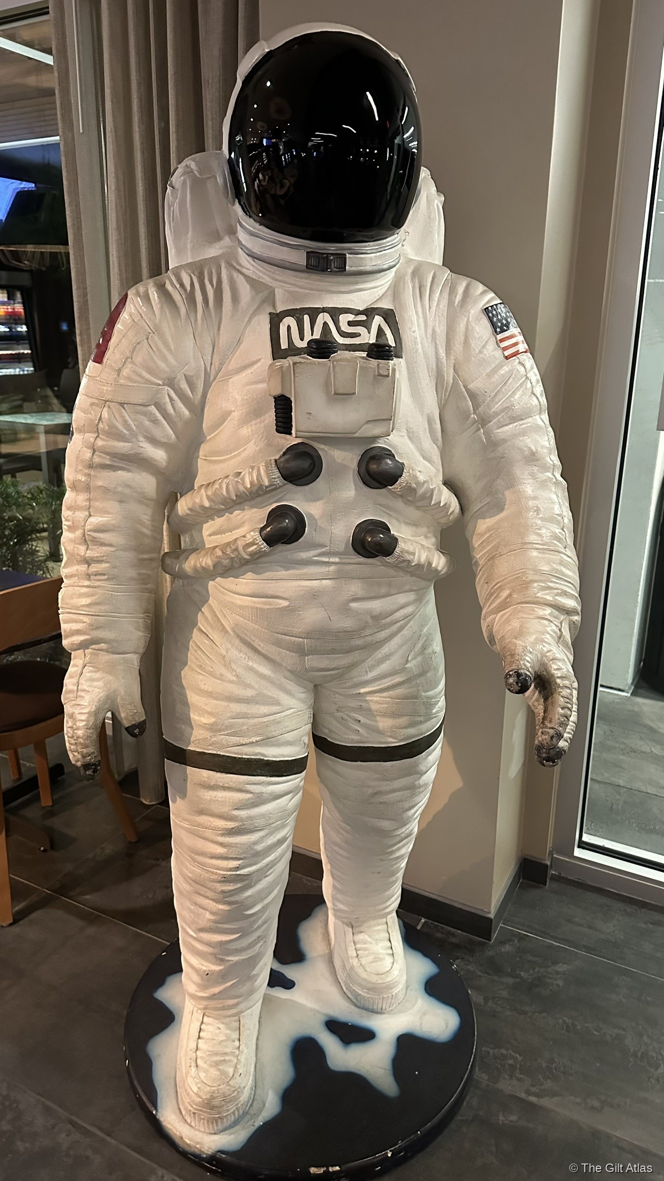 Full-scale NASA astronaut suit on display in the lobby of the Courtyard Titusville Kennedy Space Center