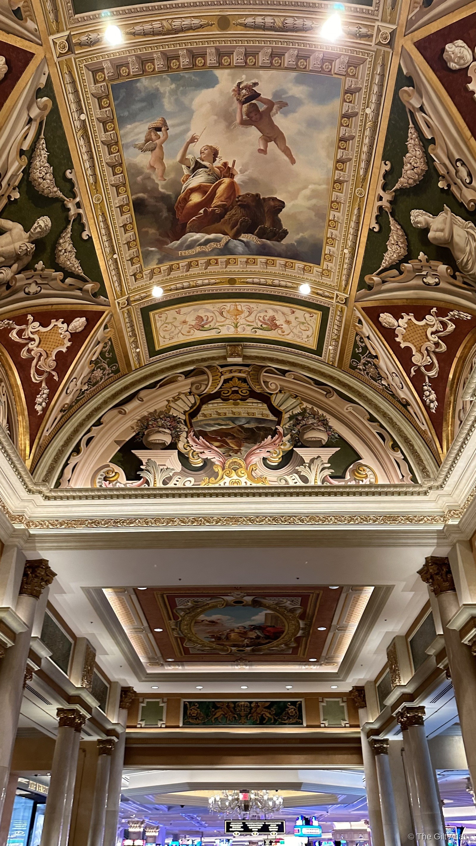 Close-up of The Venetian's painted ceiling — Renaissance-style fresco with cherubs and classical figures